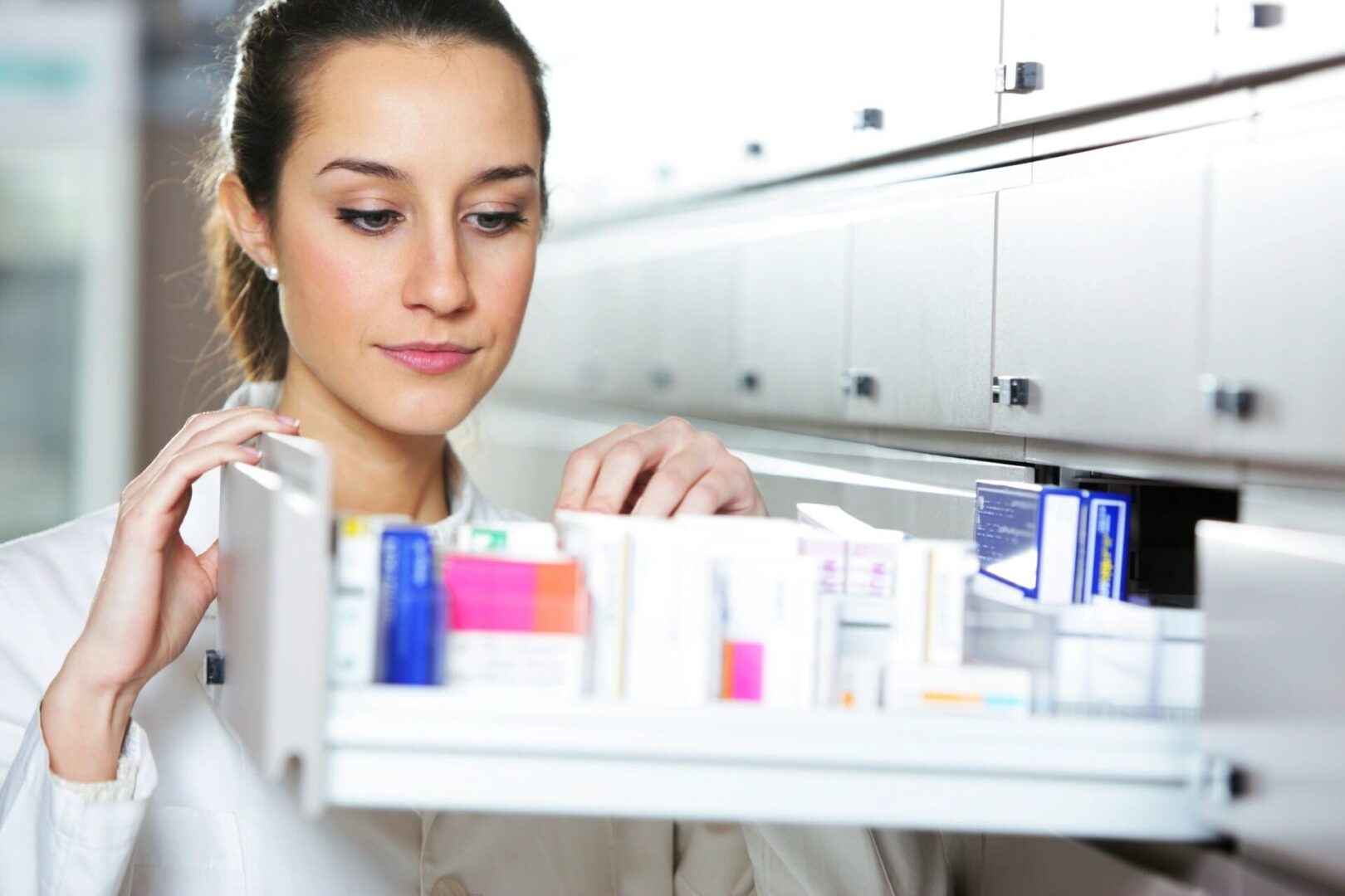 A doctor opening a drawer of supplements